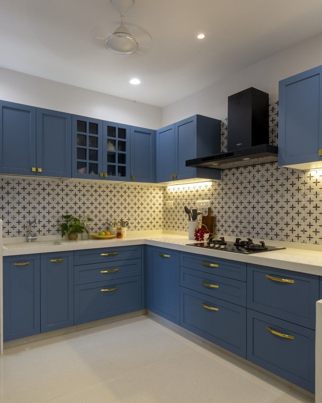 3. Soft Blue Kitchen With Patterned Tile Backsplash - navy blue kitchen ideas