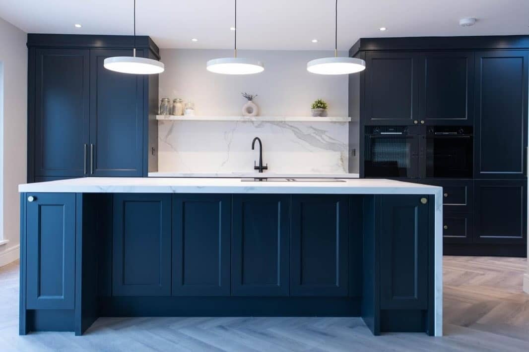 6. Contemporary Navy Blue Kitchen With Waterfall Island - navy blue kitchen ideas