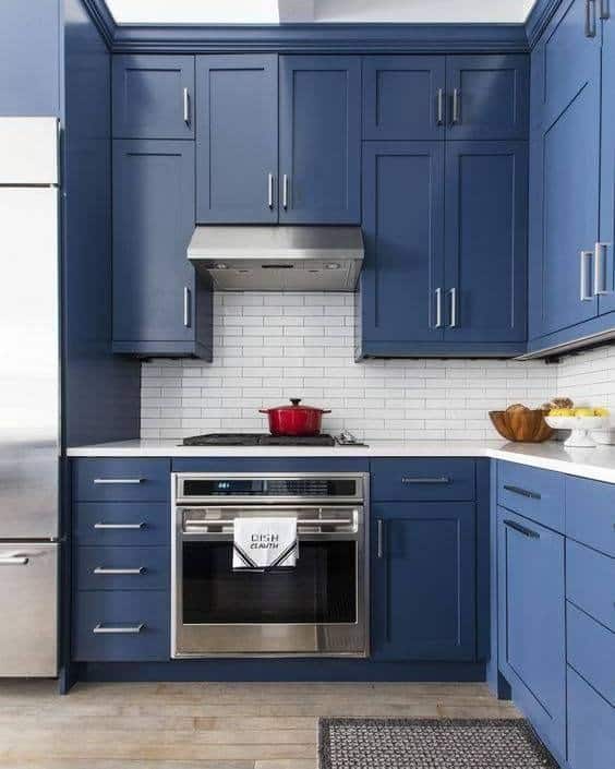 7. Transitional Blue Kitchen With Subway Tile Backsplash - navy blue kitchen ideas