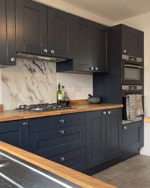 9. Navy Blue Kitchen With Warm Wood Countertops - navy blue kitchen ideas