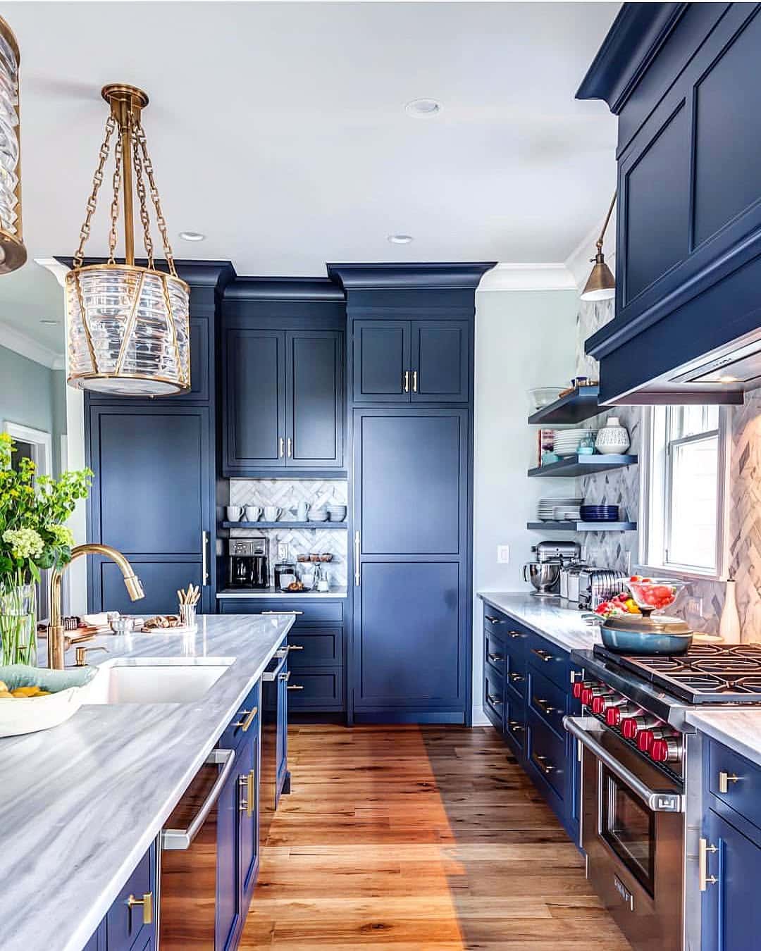 12. Elegant Navy Blue Kitchen With Brass Lighting - navy blue kitchen ideas