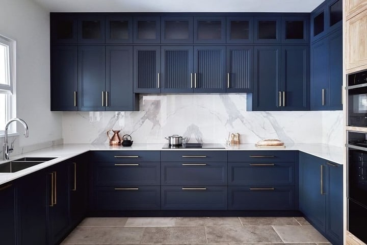 19. Navy Blue Kitchen With Full Marble Backsplash - navy blue kitchen ideas