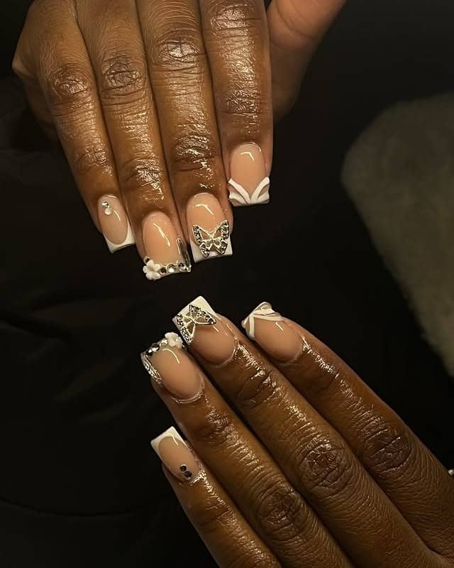 2. Nude French Bow Accent Nails - short thanksgiving nail ideas