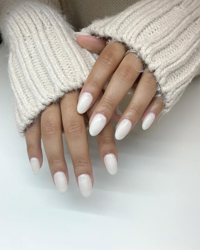 17. Milky White Almond Nails - short thanksgiving nail ideas