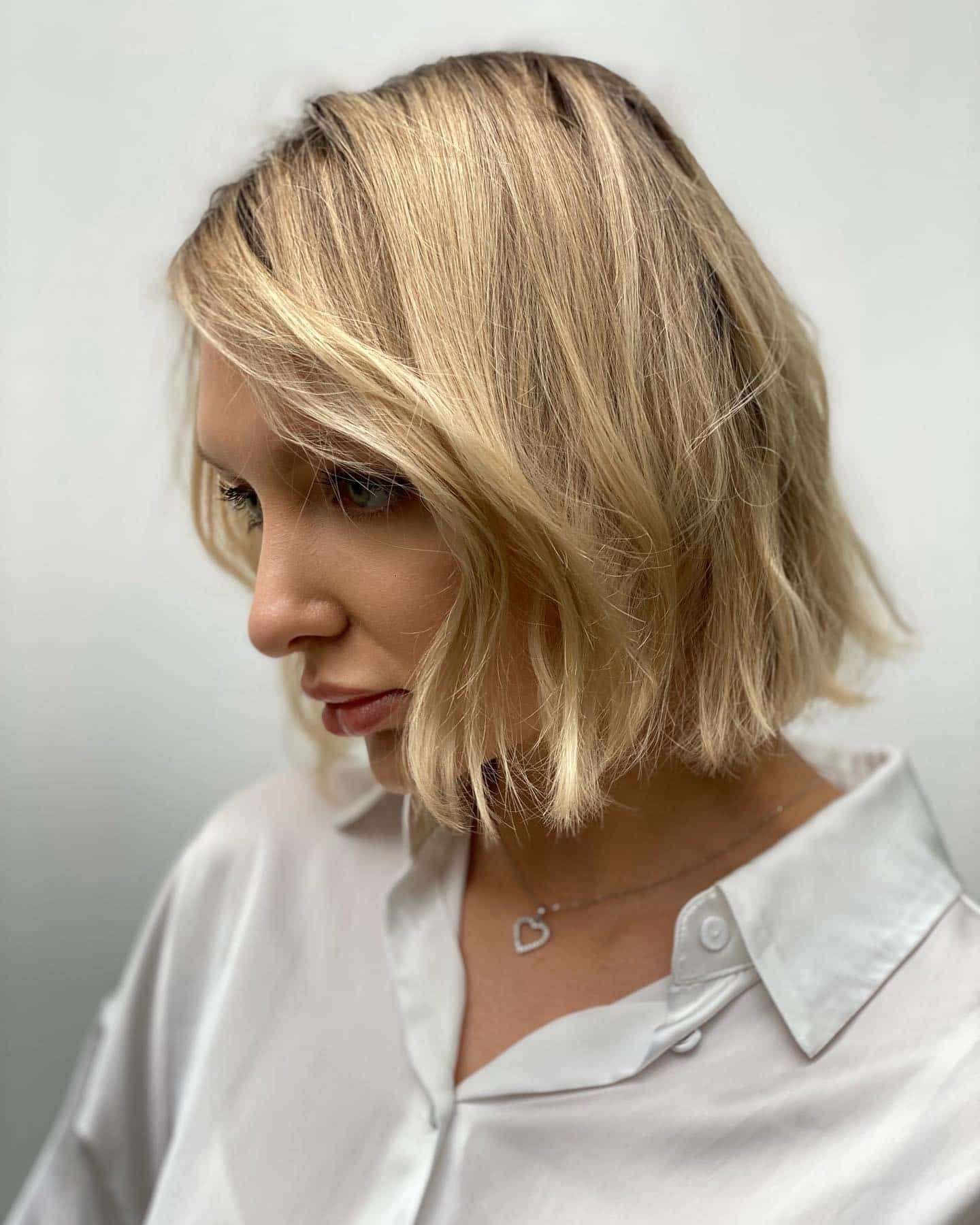 4. Icy Blonde Chin-Length Bob - Messy Bob Haircut