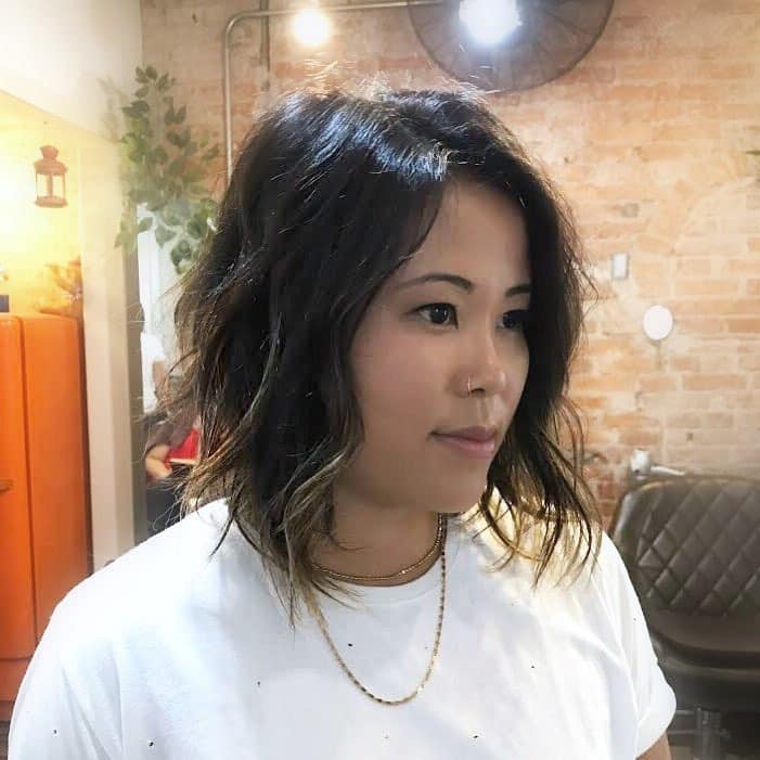 9. Dark Root Blonde Wavy Bob - Messy Bob Haircut