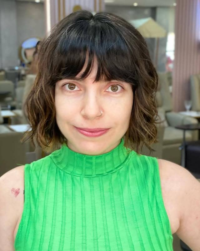 11. Tousled Espresso Bob with Wispy Bangs - Messy Bob Haircut