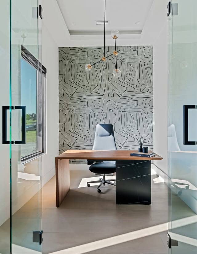 21. Modern Gray Minimalist Office with Glass Walls - minimalist home office ideas