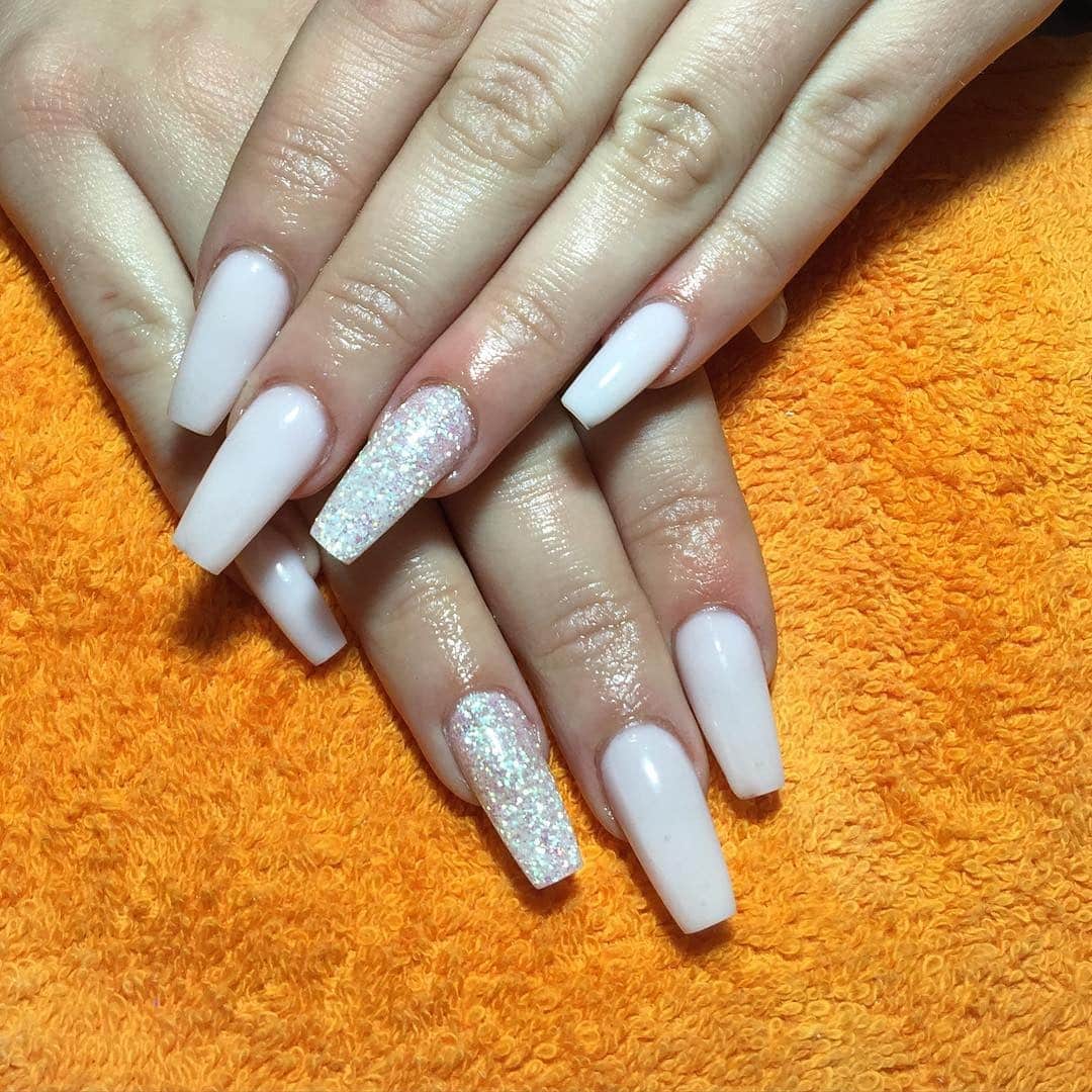 1. Milky White Coffin Nails with Glitter Accent - milky nail ideas