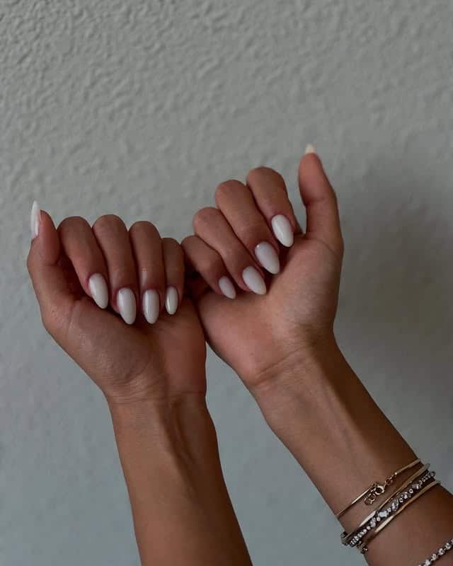 19. Short Milky White Almond Nails - milky nail ideas