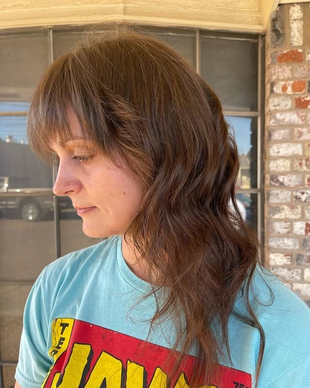 3. Chestnut Shaggy Wolf Haircut with Wispy Fringe - Layered Wolf Haircut