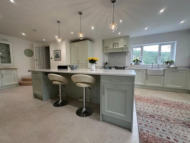 1. Soft Sage Kitchen With Waterfall Island - sage green kitchen ideas