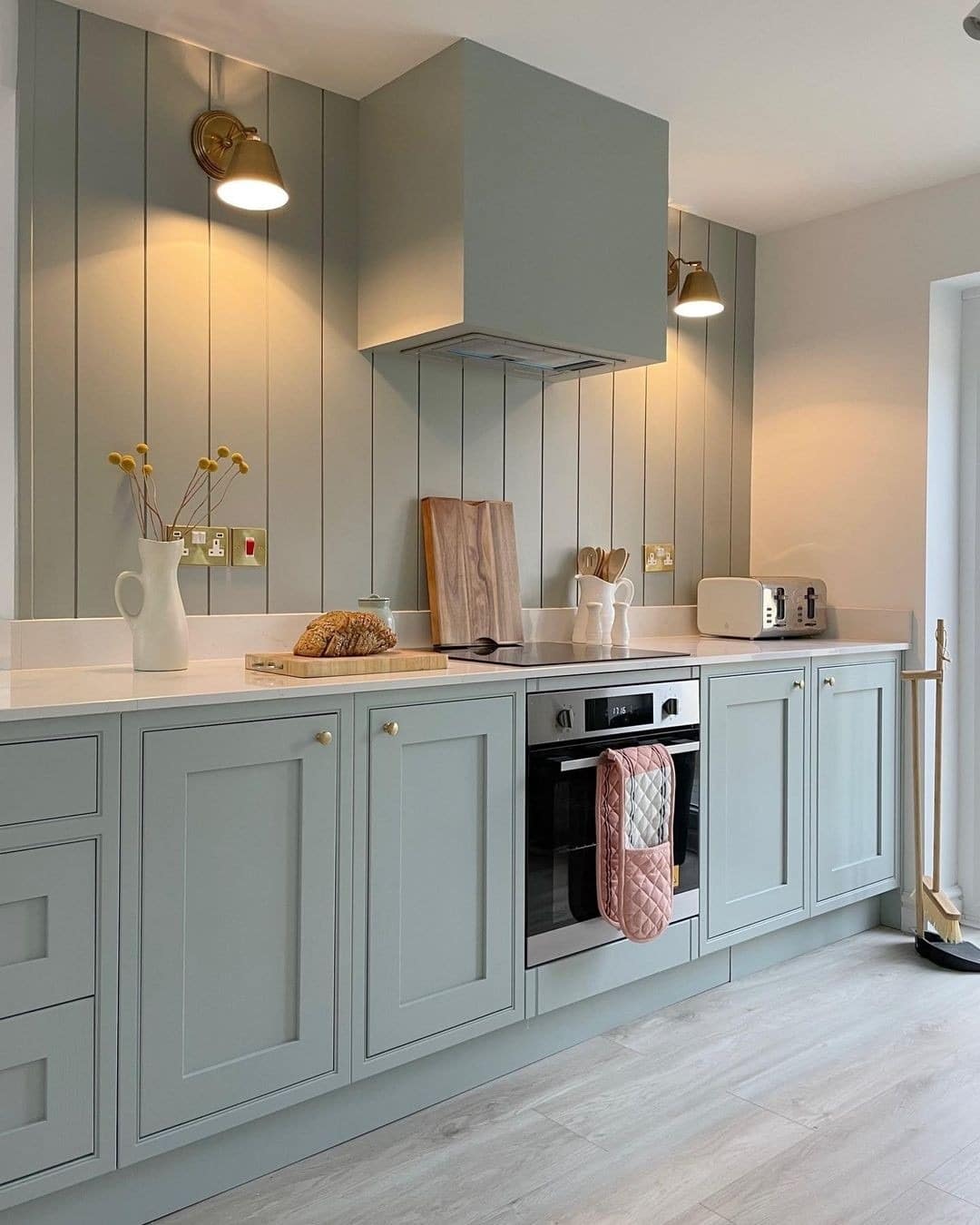 11. Powder Sage Kitchen With Panel Wall Detailing - sage green kitchen ideas