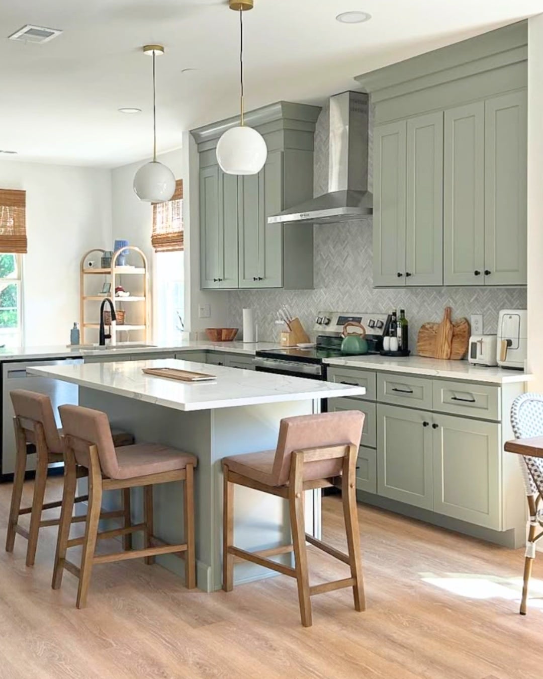 17. Soft Sage Shaker Kitchen With Herringbone Backsplash - sage green kitchen ideas