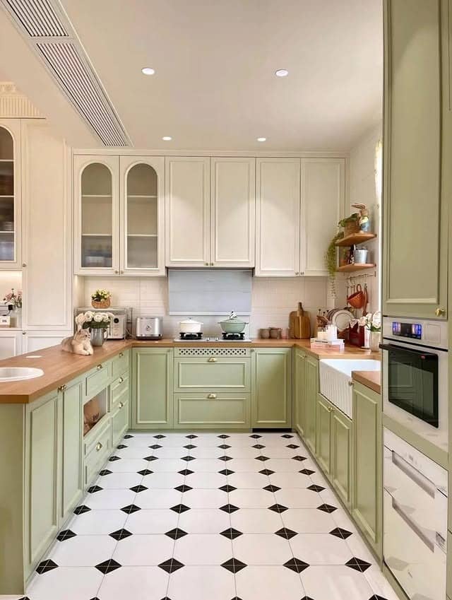 18. Vintage Sage Kitchen With Checkerboard Flooring - sage green kitchen ideas
