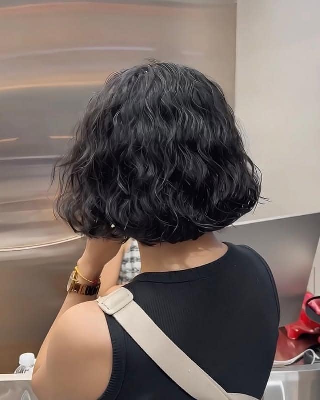 2. Textured Curly Bob with Natural Black Hair - Short Hippie Hairstyles