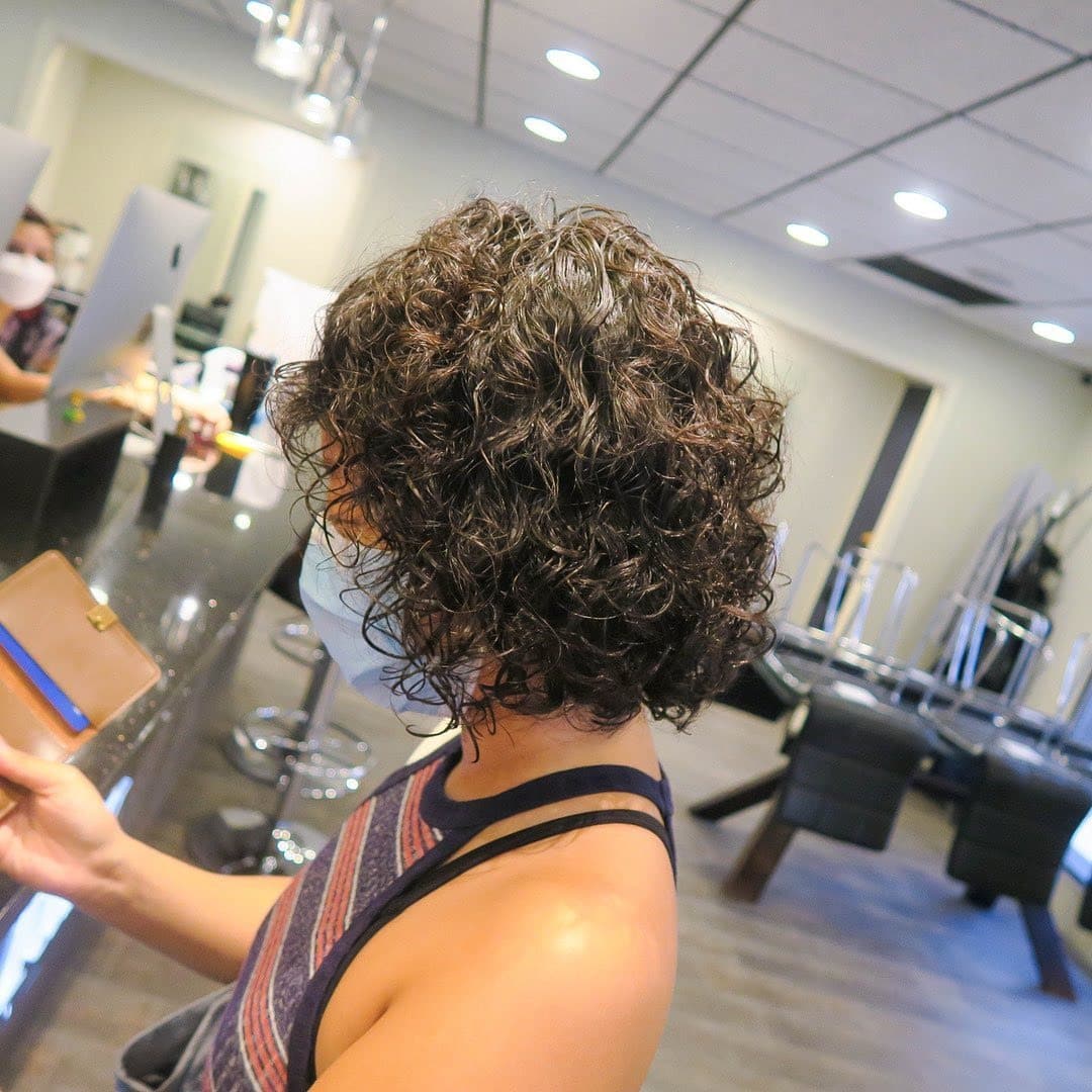 3. Layered Curly Bob with Rich Dark Brown Hair - Short Hippie Hairstyles