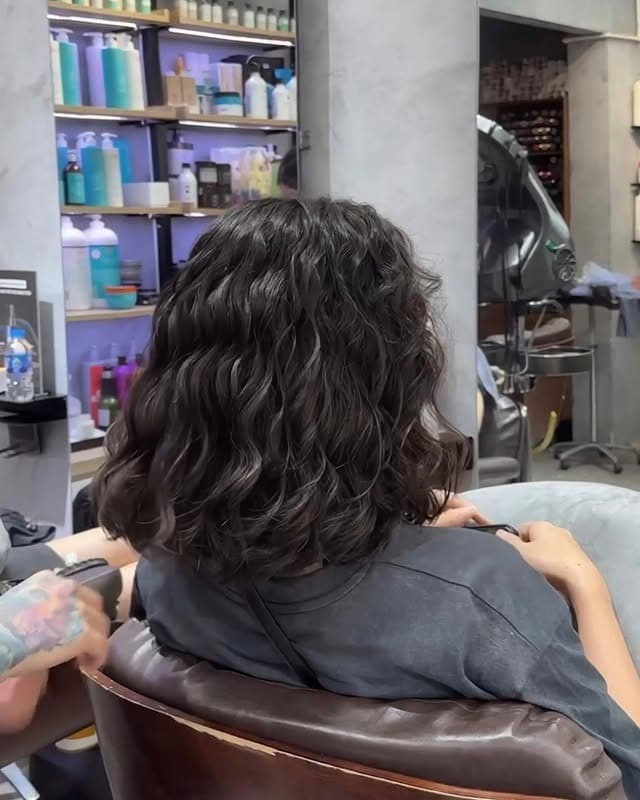 4. Shoulder-Grazing Wavy Bob with Deep Espresso Hair - Short Hippie Hairstyles