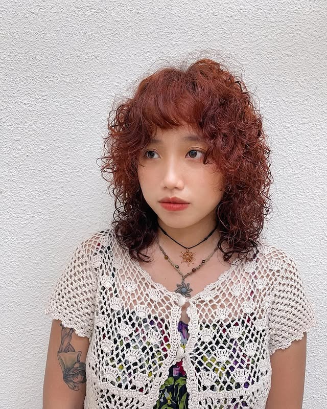 8. Shaggy Curly Mullet with Auburn Red Hair - Short Hippie Hairstyles