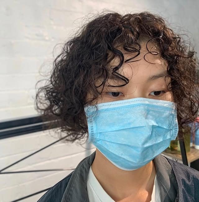 9. Short Curly Bob with Natural Dark Brown Hair - Short Hippie Hairstyles