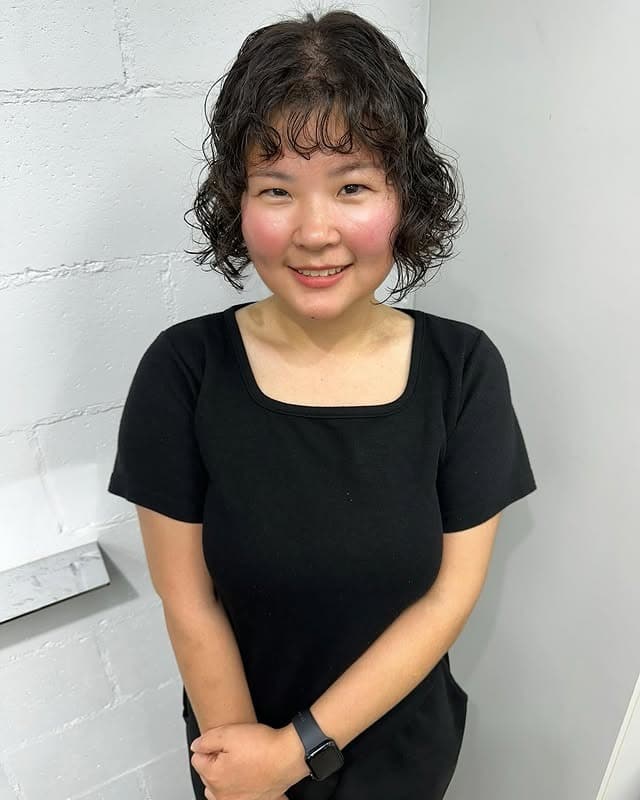 15. Short Curly Bob with Soft Black Hair - Short Hippie Hairstyles