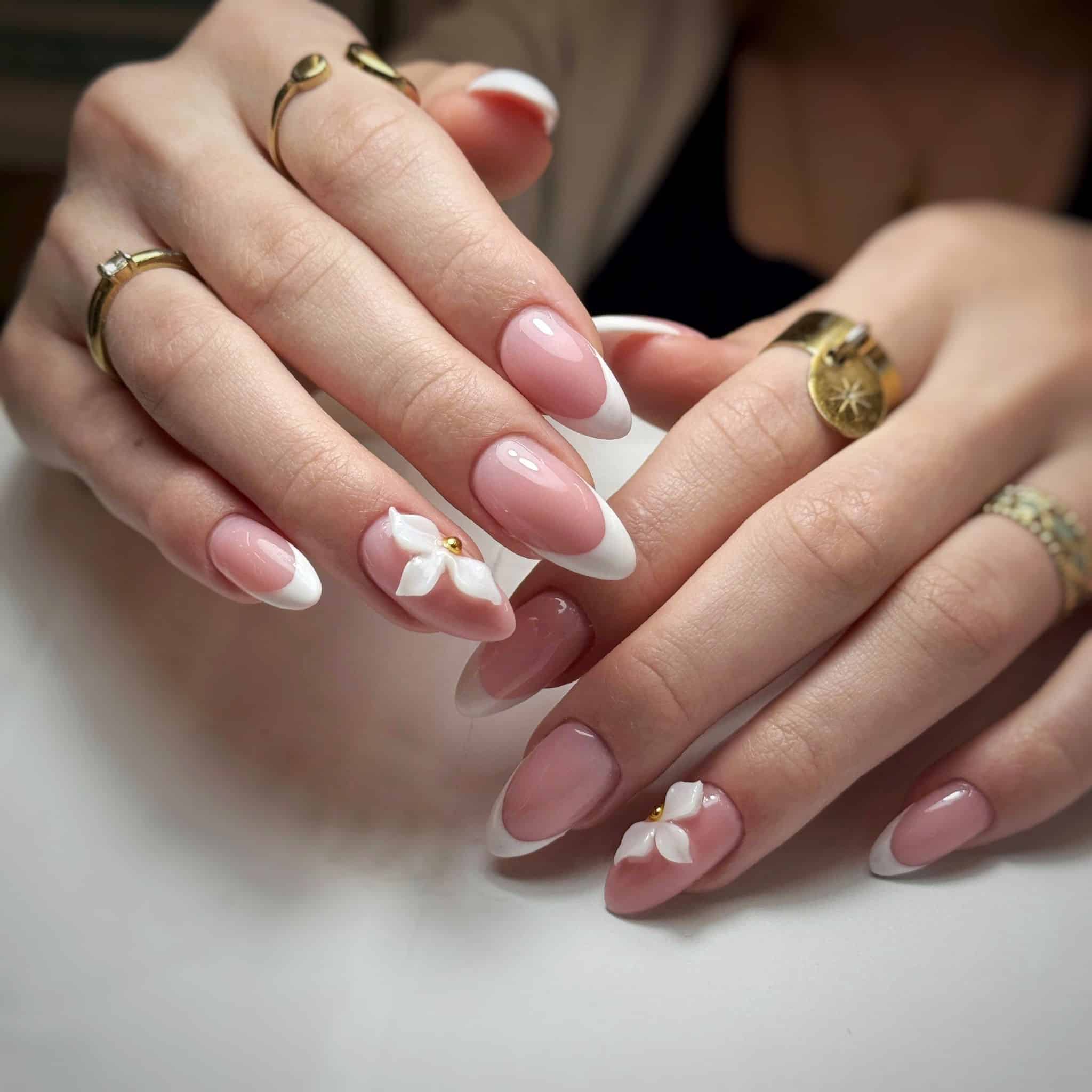 6. Almond French Manicure with 3D White Floral Details - french-manicure-nail-ideas