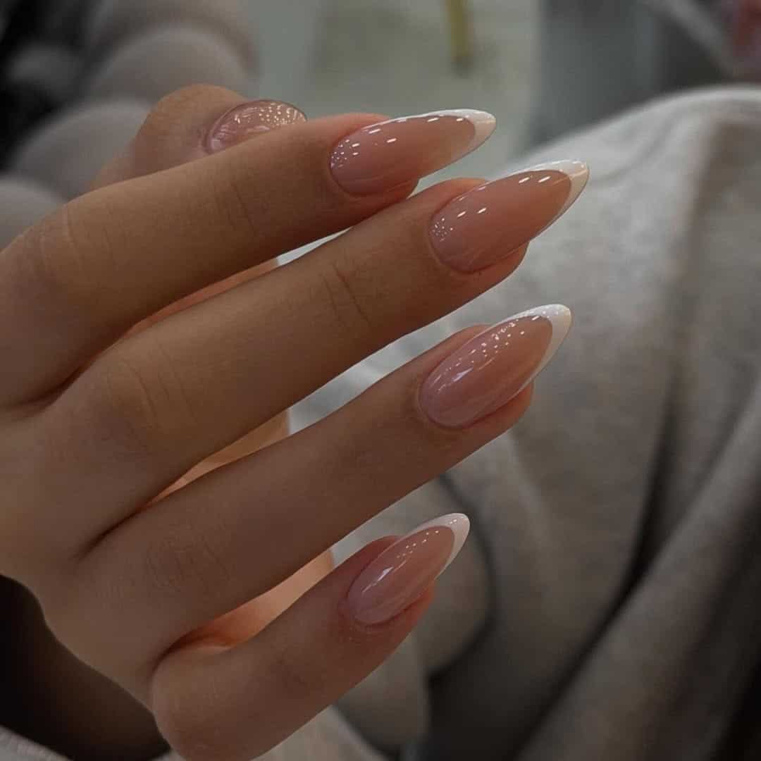 20. Glossy Stiletto French Manicure in Nude Pink and White - french-manicure-nail-ideas