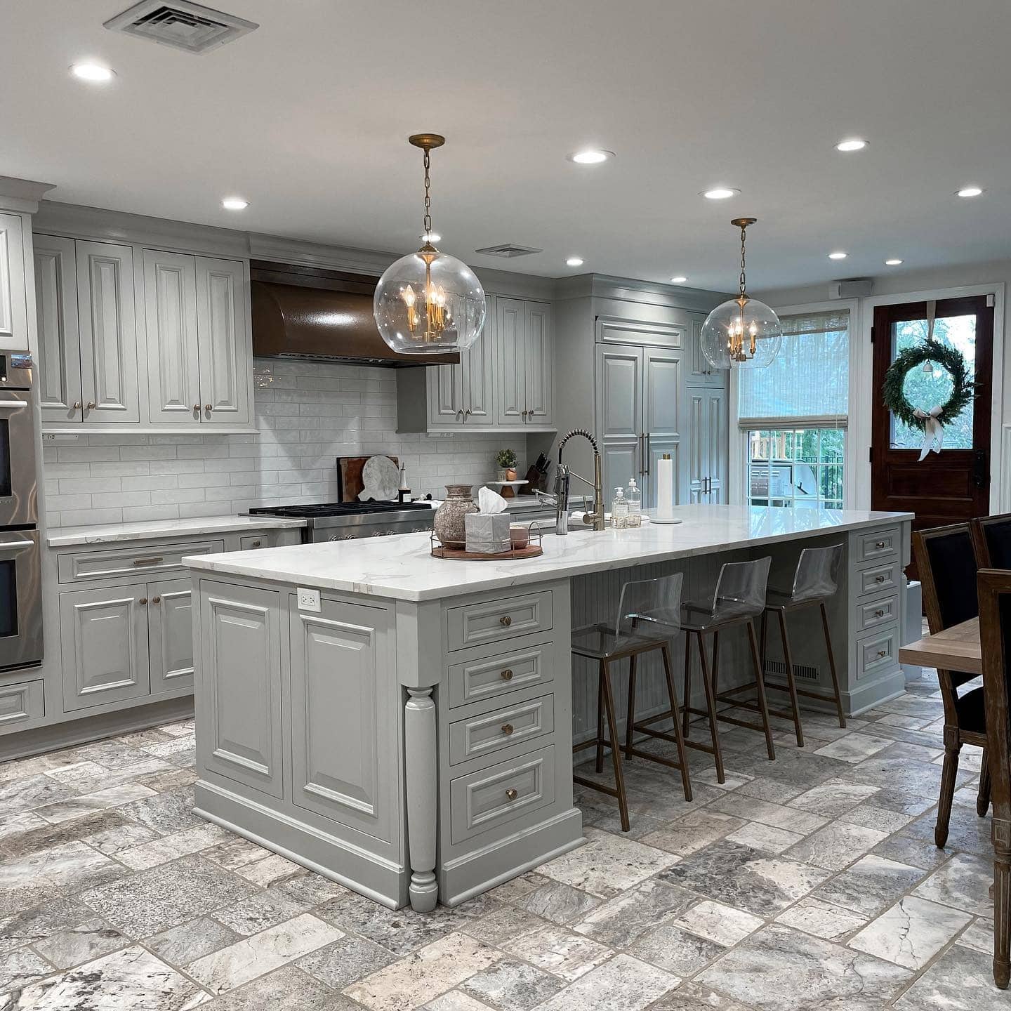 5. Transitional Gray Kitchen with Statement Island - gray kitchen ideas