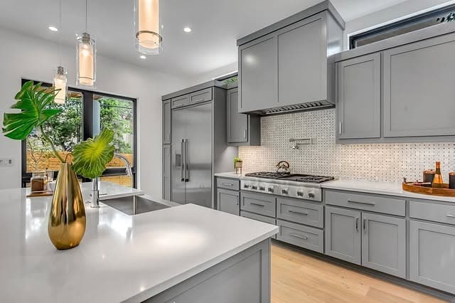 6. Charcoal Gray Kitchen with Scandinavian Warmth - gray kitchen ideas