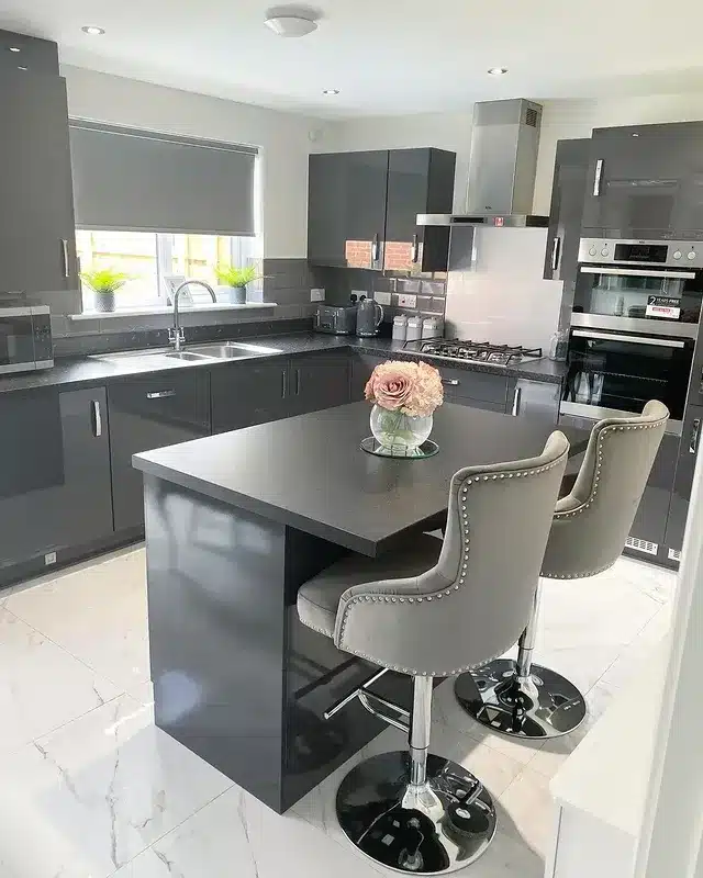 8. Dark Gray Kitchen with High-Gloss Finishes - gray kitchen ideas