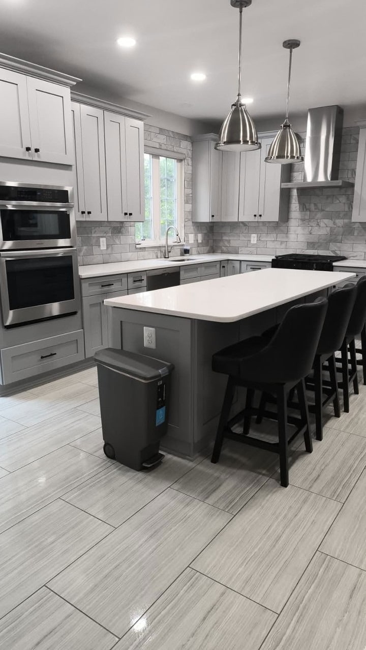 12. Light Gray Kitchen with Waterfall Island - gray kitchen ideas