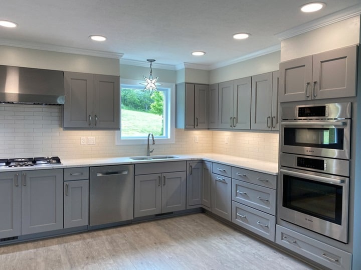 18. Transitional Gray Kitchen with Under-Cabinet Lighting - gray kitchen ideas