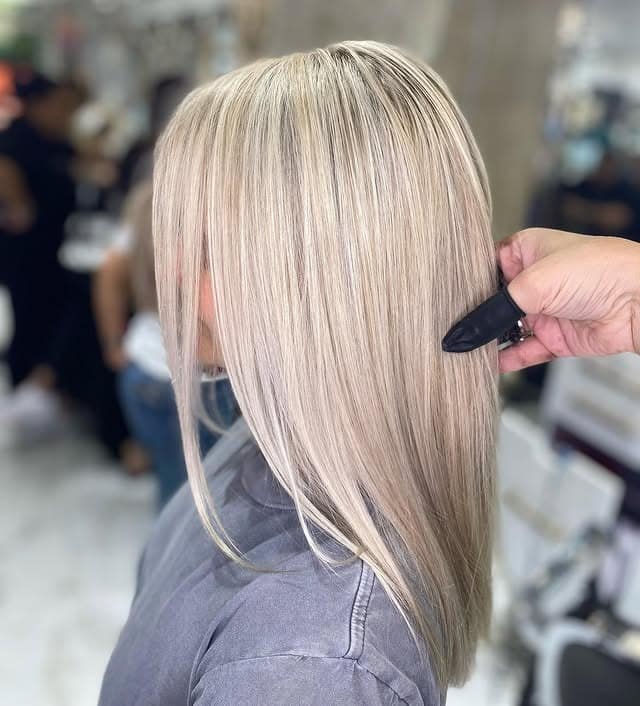 9. Icy Blonde Money Piece with Long Waves - Icy Blonde Hair Color