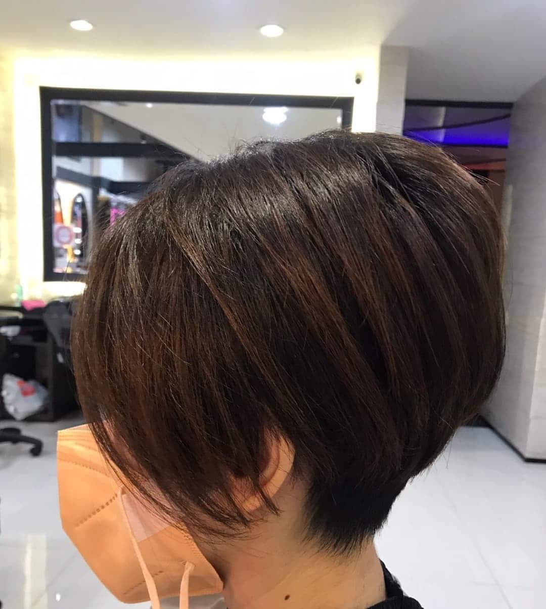6. Chocolate Brown Layered Pixie Bob - Side Swept Pixie
