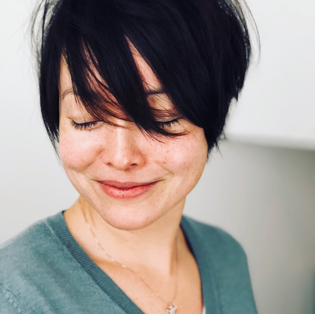 11. Jet Black Side-Swept Pixie with Long Fringe - Side Swept Pixie