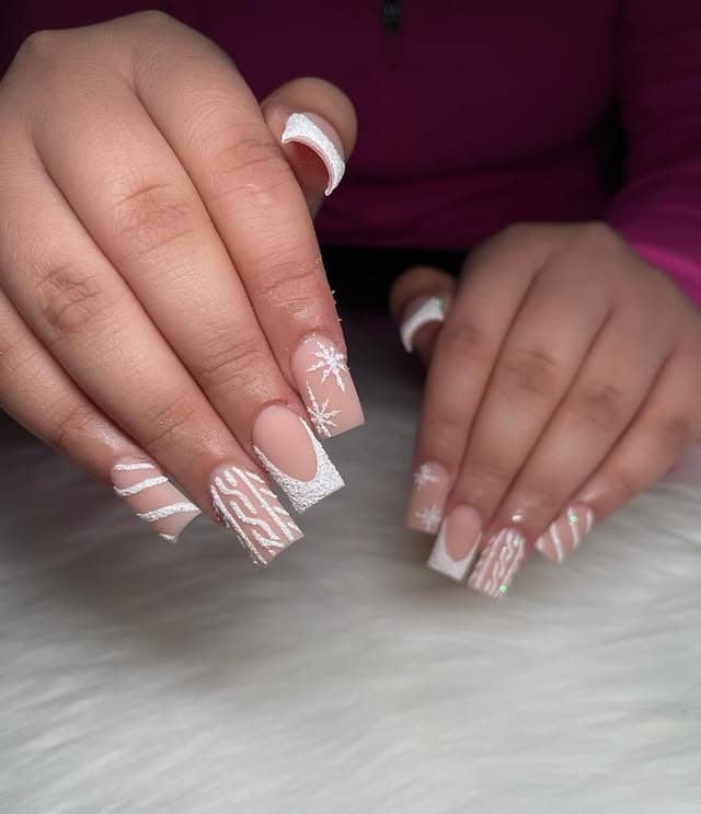 7. Nude and White Glitter Winter Mix Nails - white winter nail ideas