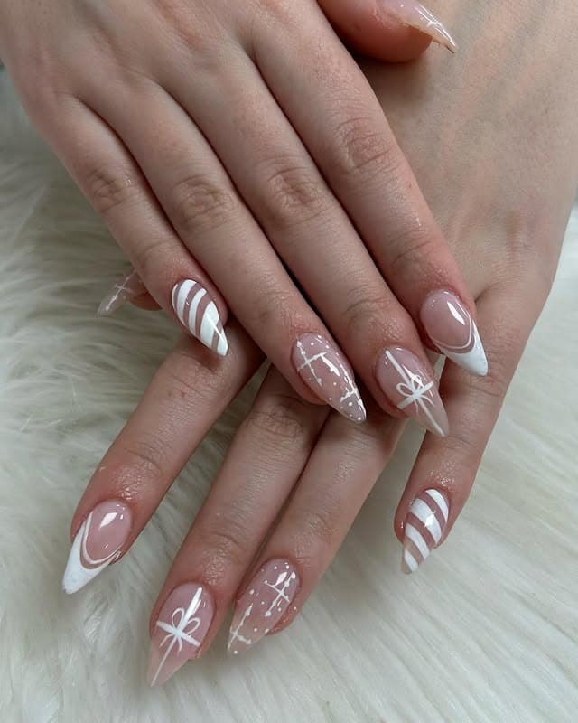 10. White Winter Ribbon Almond Nails - white winter nail ideas