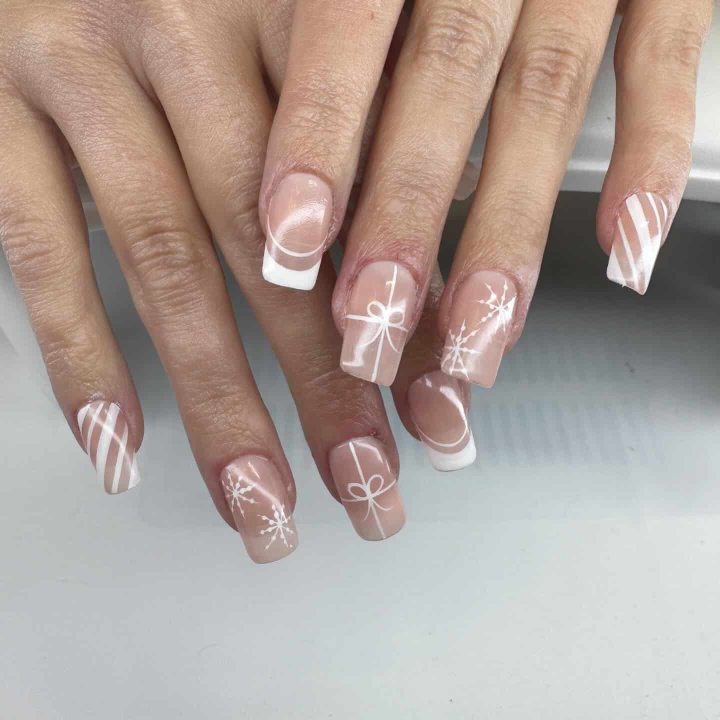 15. Nude and White Ribbon Snowflake Nails - white winter nail ideas