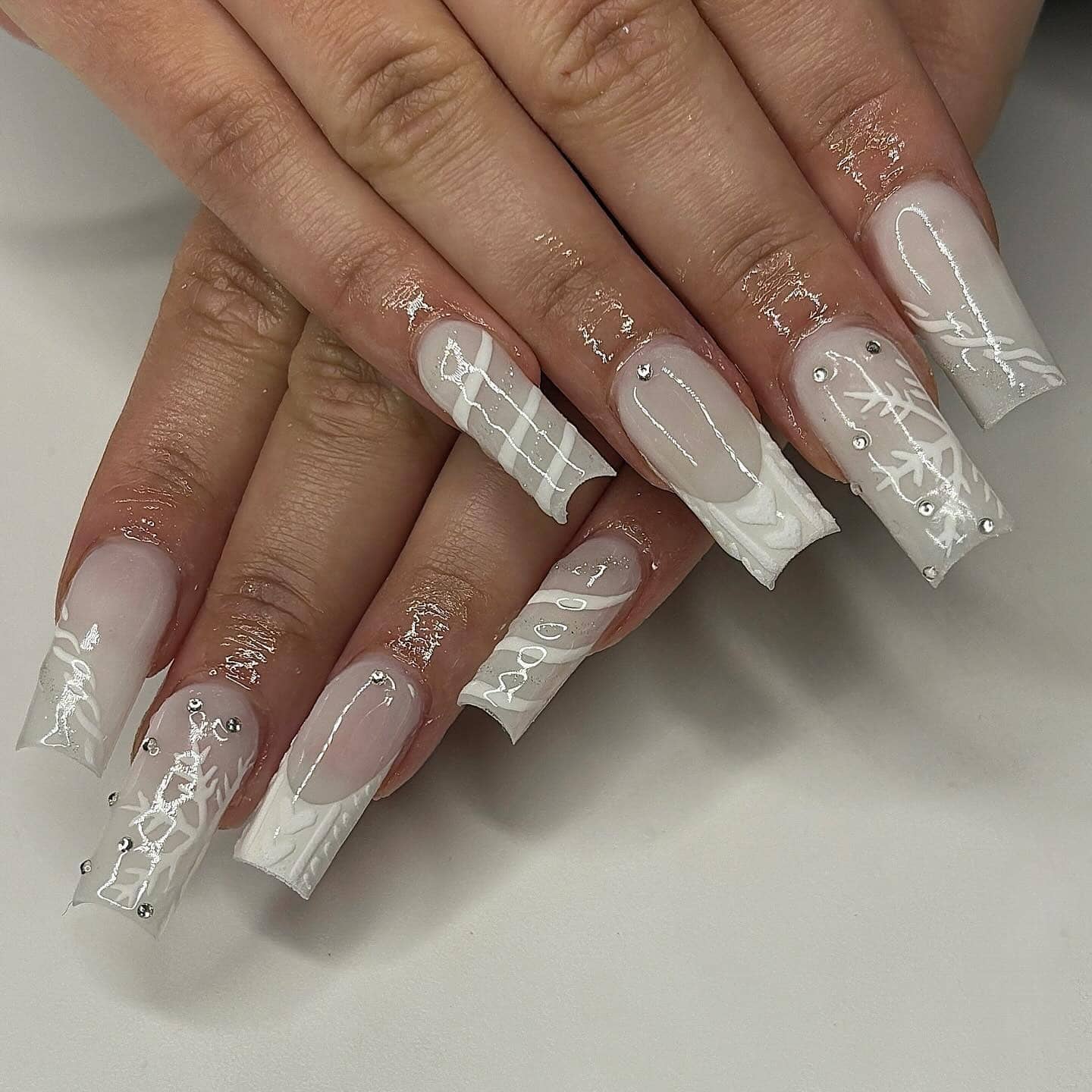 16. White Sweater Texture and Snowflake Coffin Nails - white winter nail ideas
