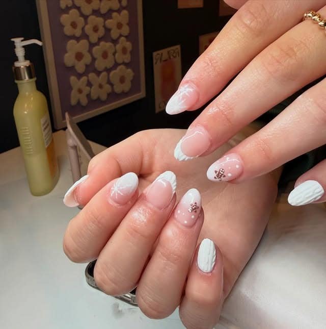 18. White Sweater and Snowflake Almond Nails - white winter nail ideas