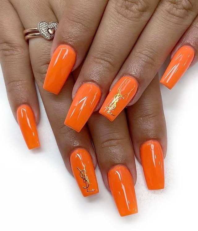 10. Glossy Neon Orange Coffin Nails - orange color nail ideas