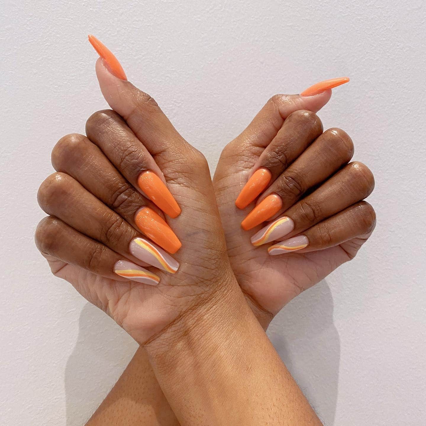14. Peach Orange Swirl Coffin Nails - orange color nail ideas