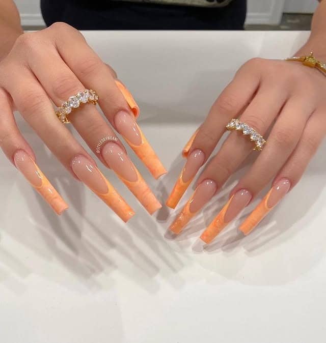 17. Peach Marble French Coffin Nails - orange color nail ideas