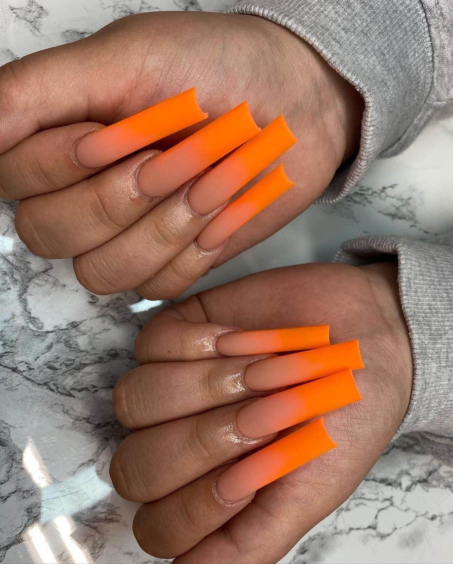 20. Matte Neon Orange Ombre Coffin Nails - orange color nail ideas