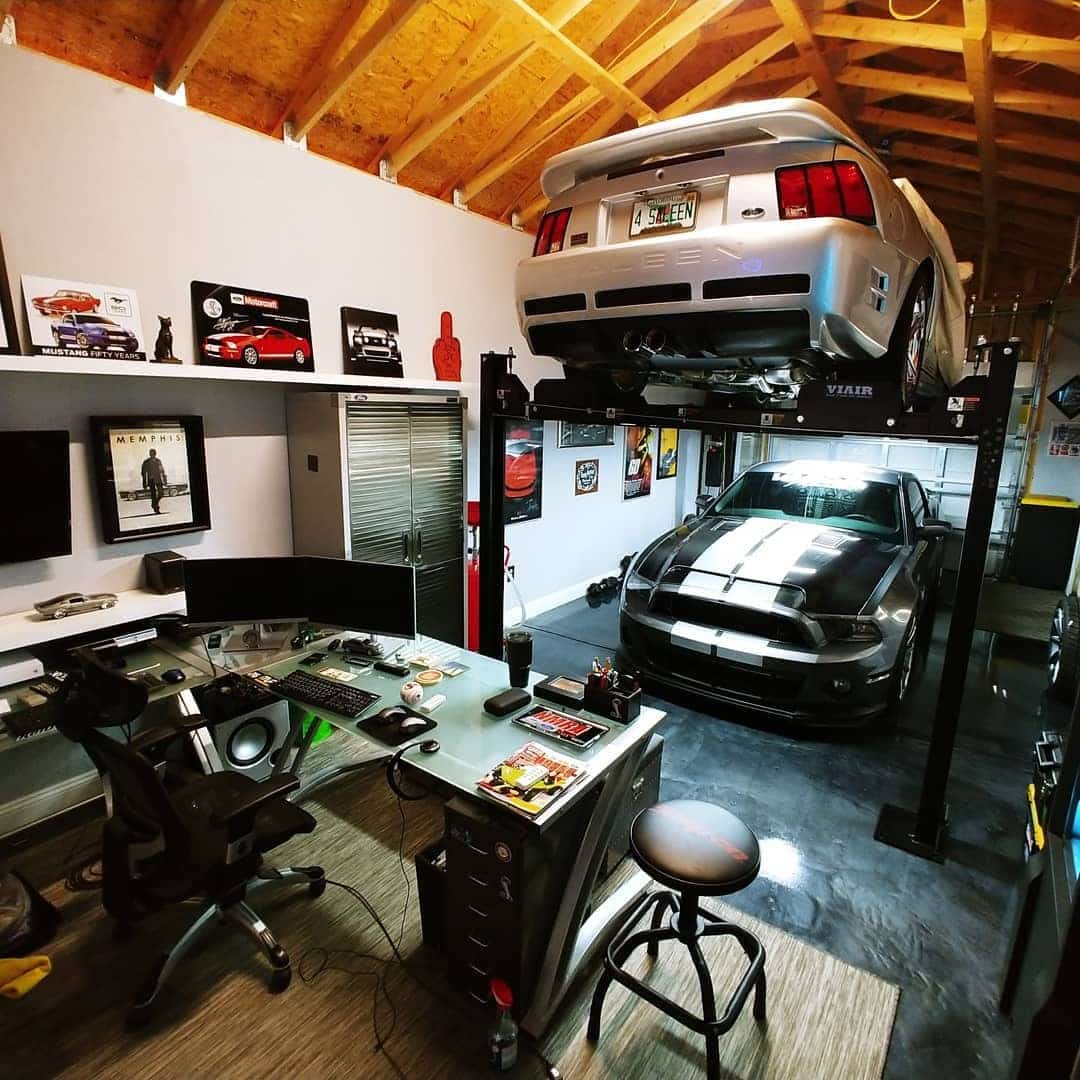 10. Black, Silver, and Wood Automotive Garage Office - garage office ideas