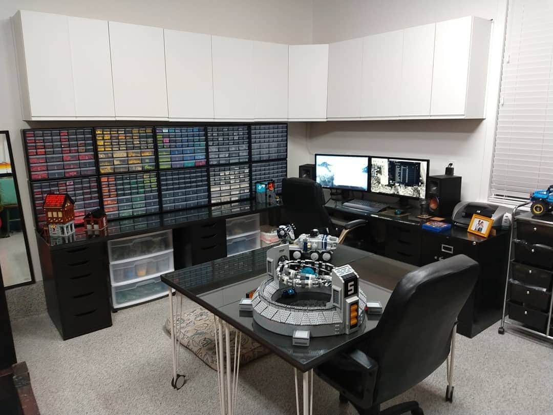 12. Black and White Collector’s Garage Office with Custom Storage - garage office ideas