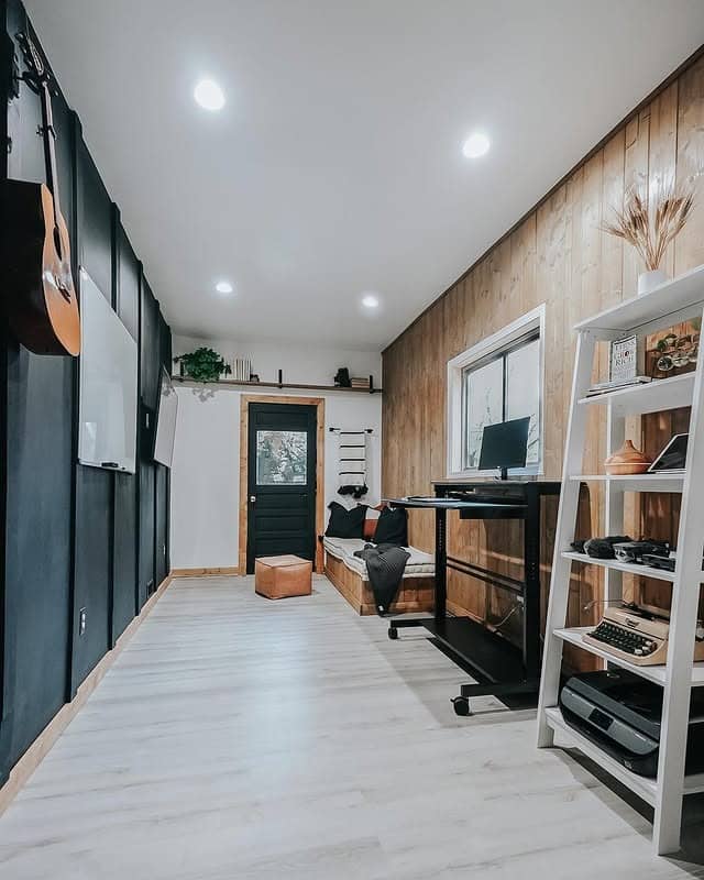 14. Black and Natural Wood Garage Office with Lounge Nook - garage office ideas