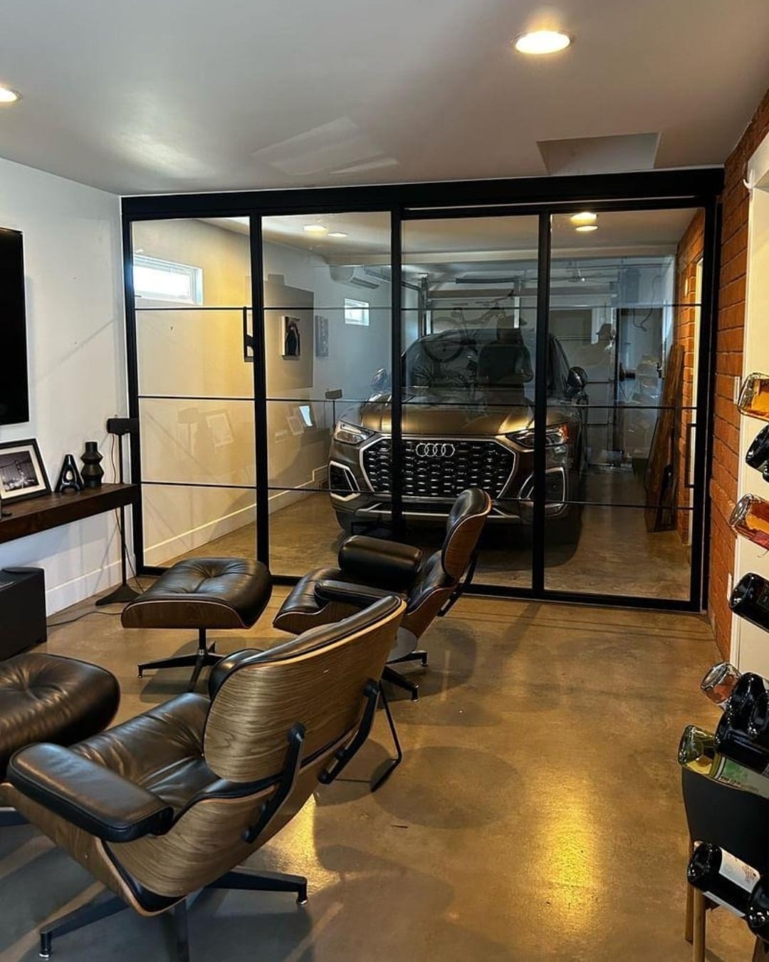 22. Black, Walnut, and Glass Luxury Garage Office Lounge - garage office ideas