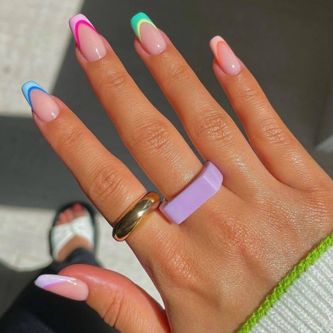 7. Rainbow Outline French Tips - short spring break nail ideas