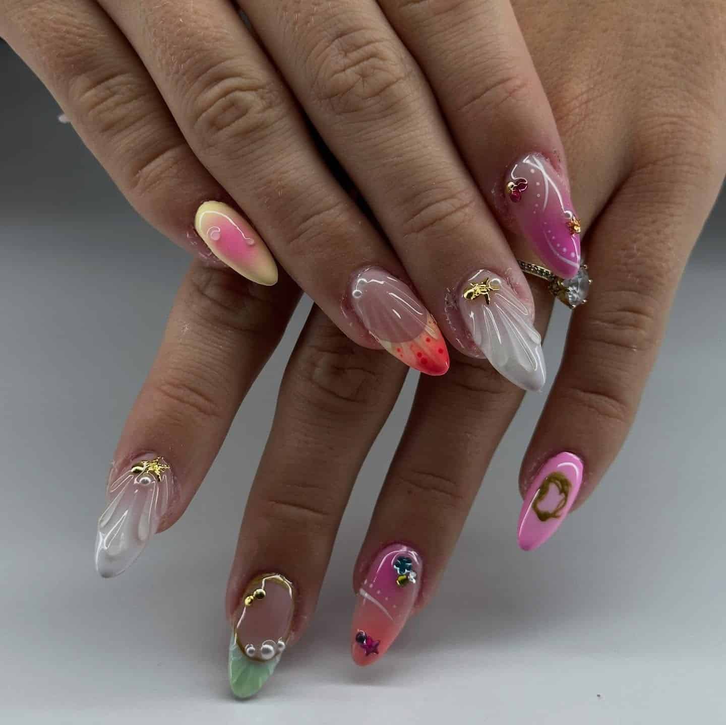 9. Spring Garden Mixed Art Almond Nails - short spring break nail ideas